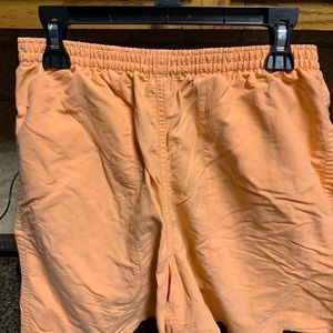 Peach colored swim trunks with lining
